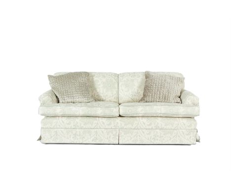 A MODERN 'JUBILEE' UPHOLSTERED SOFA, covered in Palampour Blossom, eau de Nil fabric, having two loose cushions, with contras