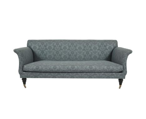 A REGENCY STYLE MAHOGANY FRAMED UPHOLSTERED SOFA, with twin curved arms and single cushion seat, covered in grey/blue figured