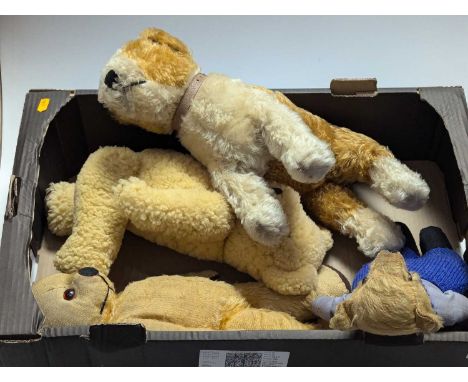 A vintage blond mohair teddy-bear, having glass eyes and stitched body; together with a vintage Merrythought dog and two furt