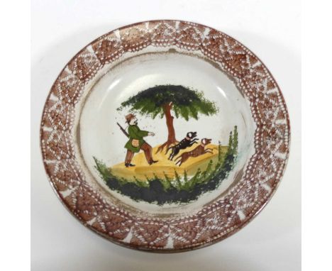 A continental pottery bowl, possibly Alsace, polychrome decorated with a hunting scene, dia. 22.5cm
