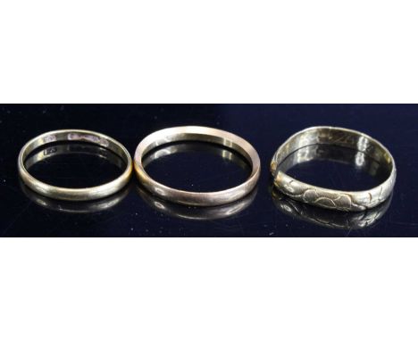 A 22ct gold wedding band, size O; together with one other, size K; and another being cut, gross weight 6.6g (3)