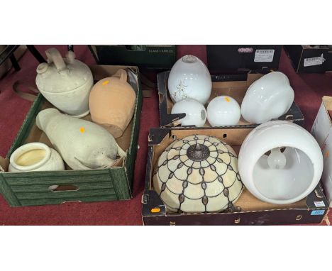 Four boxes of miscellaneous items to include light shades, tins and ceramics