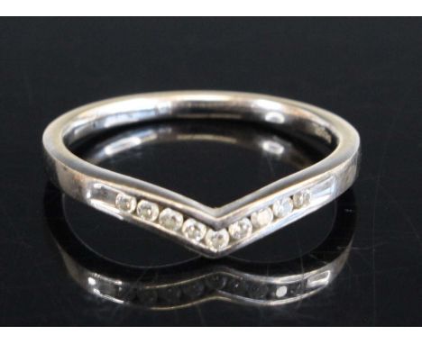 A 9ct white gold 1.8mm diamond wishbone ring, having five round brilliant cut diamonds channel set, total weight estimated as