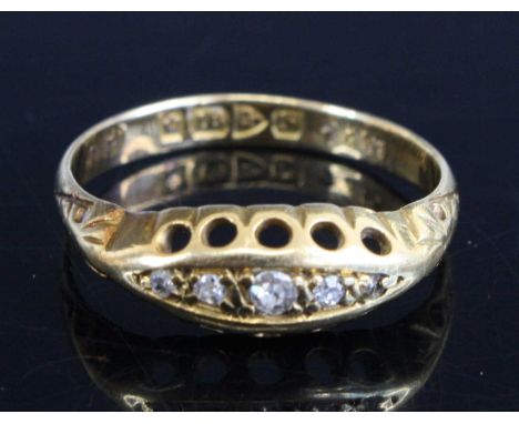 An Edwardian 18ct gold and diamond dress ring, arranged as five small graduated old round cuts in a lozenge setting, 2.5g, si