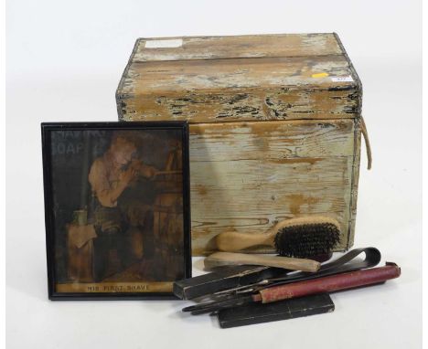 A stripped pine trunk containing a collection of barbers related items, to include razors, brushes, and clippers