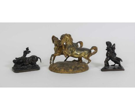 A gilt metal group of prancing horses, height 13cm, together with a bronze of a putti and a swan, height 9.5cm, and another b