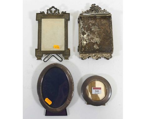 A silver framed oval easel photograph frame, sight 13 x 9cm; together with another silver framed easel photograph frame; a br