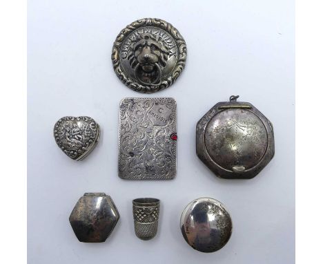 A George V silver stamp case of compact rectangular form, the sliding cover having engraved decoration, shield shaped cartouc