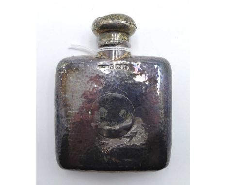 An Edwardian silver hip flask of slightly curved rectangular form, having hammer beaten decoration, Birmingham 1902, 2.2oztLa