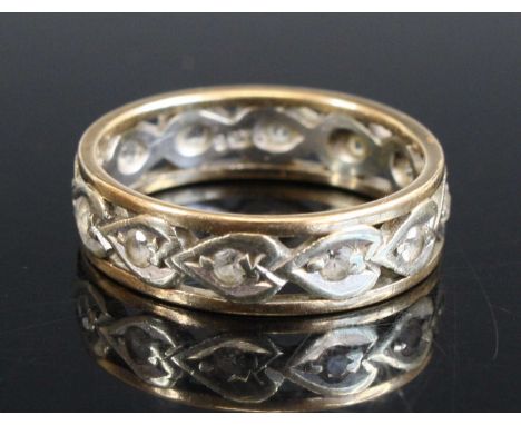 A 9ct yellow and white gold, white stone set band ring, size O, 3.6g
