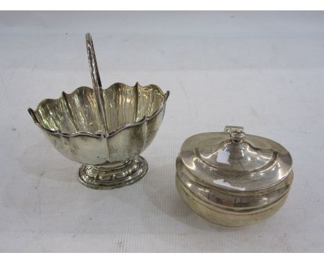 Silver tea caddy by C S Harris &amp; Sons Ltd, London 1921 of oval form with hinged cover, 11cm long and a silver swing handl