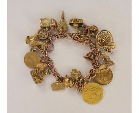 Rose gold-coloured curb link charm bracelet having multiple charms, including 19th century gold-coloured fob with amethyst-co