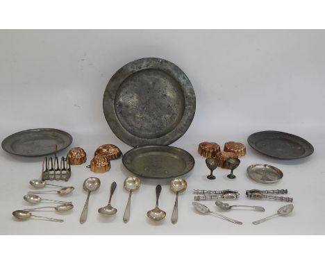Six copper jelly moulds, three pewter plates and assorted EPNS flatware 