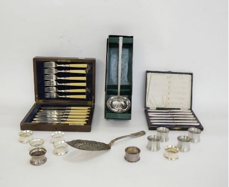 Silver-plated fish server, assorted napkin rings in stainless steel and EPNS, a Viners stainless steel ladle in original box,