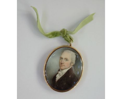 Georgian portrait miniature on ivory, oval, head and shoulders portrait of a gentleman, 6.75cm x 5.5cm, in gold-coloured meta