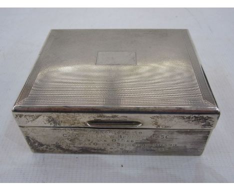 Silver engine-turned decorated and lined cigarette box with inscription 'Presented to Captain I. H. W. Bennett, RASC by the O