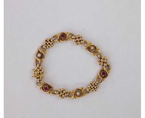 15ct gold, pearl and ruby-coloured stone ornate bracelet, trellis and scroll links set with three old cut rubies and three pe