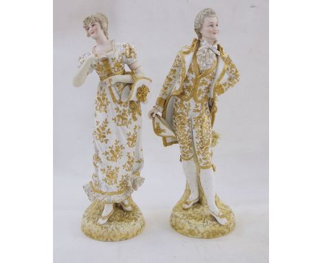 Pair 19th century Sitzendorf gilt porcelain figures of lady and gentleman, the lady carrying bonnet and fan, the man with swo