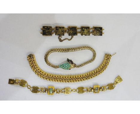 Gold-plated, turquoise and ruby set serpent bracelet, two foreign gilt metal bracelets and gold-plated expanding bracelet, on
