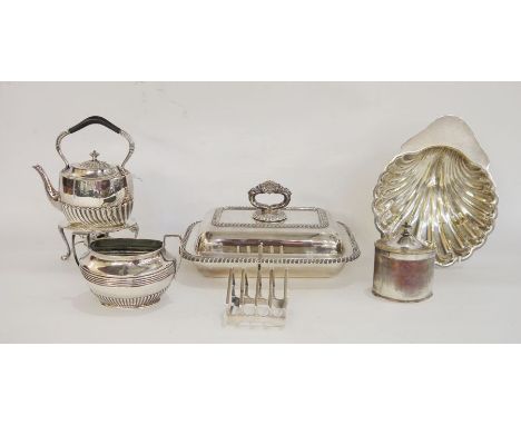 Silver-plated kettle/teapot on paraffin stand, a sugar dish, a toast rack, a lidded tureen, a small tea caddy and a scallopsh