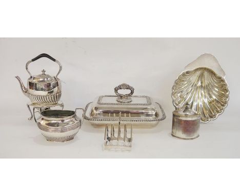 Silver-plated kettle/teapot on paraffin stand, a sugar dish, a toast rack, a lidded tureen, a small tea caddy and a scallopsh