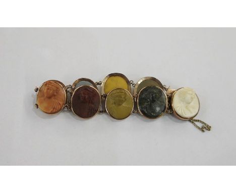 Gold-coloured metal and lava cameo portrait medallion bracelet with nine portrait medallions (some damaged)