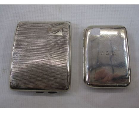 Silver engine-turned cigarette case and a plain silver cigarette case with engraved initials (2) 