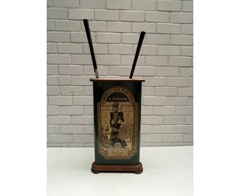 Wooden golf club holder in a shape of a triangle with very nice decals on it. The holder contains a pair of vintage golf shoe