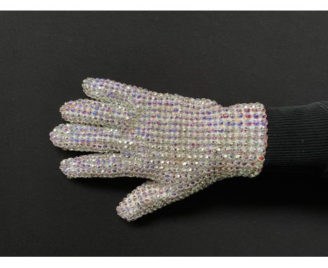 This MJ Swarovski Glove was worn by Michael Jackson on the first leg of the history world tour in 1996. On the inside of the 