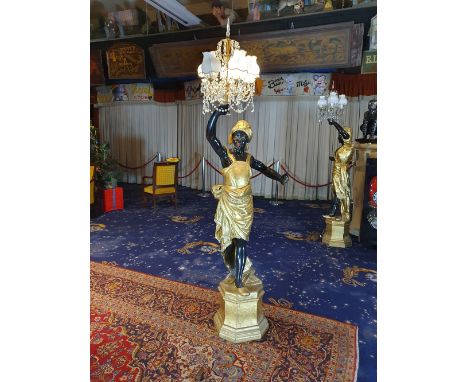 Wooden black servant man statue - floor standing lamp. The statues features intricate details and a beautiful paint job finis