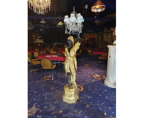 Wooden black servant woman statue - floor standing lamp. The statues features intricate details and a beautiful paint job fin