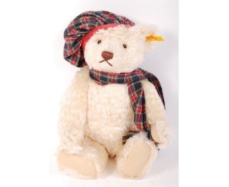 A 20th century Steiff teddy bear ' Hamish '. White mohair, with glass eyes. Complete with ear tag, hat and scarf. Measures ap