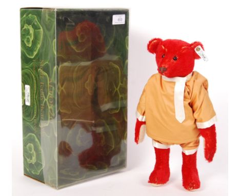 A rare Steiff 19008 reissue teddy bear - ' Alfonzo '. Red mohair, with glass eyes and tailored outfit. Tag to ear. Limited ed