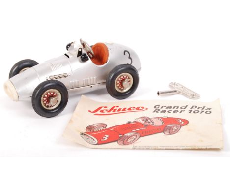 A rare vintage Schuco made ' Grand Prix Racer 1070 ' tinplate clockwork racing car. Silver, No.3, complete with key and origi