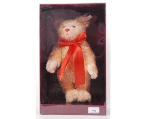 A Limited Edition ' Hamleys Exclusive ' Steiff teddy bear - ' Chester '. Mohair fur, with glass eyes and large orange bow. On