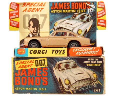 An original vintage Corgi Toys diecast model No. 261 ' James Bond 007 Aston Martin DB5 .' In gold, with silver spoked wheels.