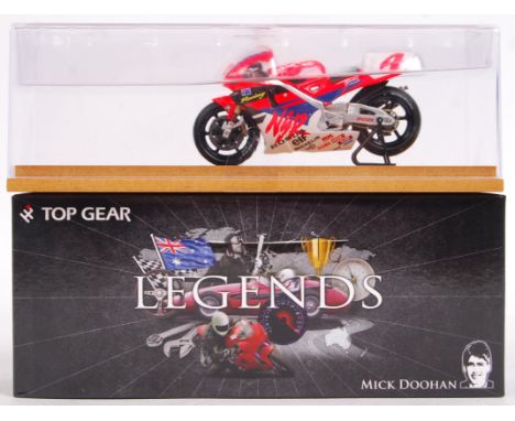 A superbly detailed 1:43 scale precision diecast model by Top Gear. From the ' Legends ' series. TGL02 - Mick Doohan, Honda N