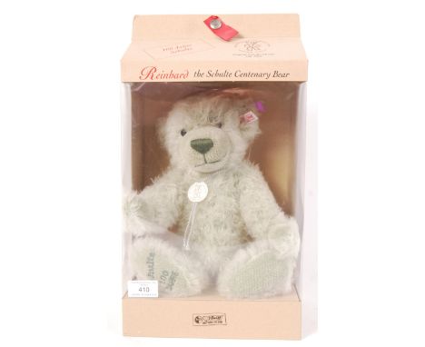 A Steiff ' Reinhard - The Schulte Centenary Bear ' boxed teddy bear. Appears as new, with tags. Within the original display b