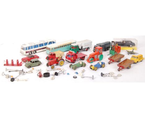 A large collection of loose vintage Dinky diecast scale model vehicles to include; Austin Devon , Volkswagen Karmann Ghia , F