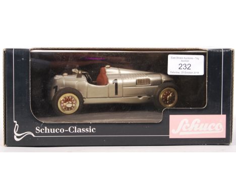 A Schuco Classic made 1:18 scale (approx) tinplate clockwork model No. 01220 ' Studio II Auto Union '. Silver, with brown sea