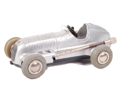 A rare vintage Schuco made ' Micro Racer ' clockwork racing car 1043/2 ' Mercedes Model 1935 '. Silver, with black steering w