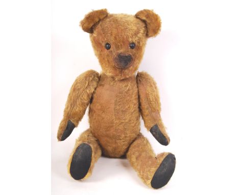 A charming vintage / antique English teddy bear (possibly a Chad Valley ' Smiler ' bear ). Glass eyes, with short shaved moha