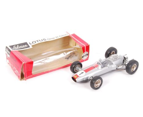 An original vintage Schuco made ' Lotus Climax 33 Formel 1 ' ( Formula 1 ) clockwork model racing car. No. 1071. Appears gene
