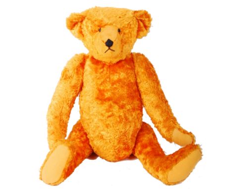 A vintage ' Newark ' type artificial silk plush teddy bear - golden / orange in colour, in a Steiff manner. Large pronounced 