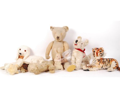 A collection of assorted antique and vintage teddy bears and stuffed toys. To include a vintage Spaniel stuffed toy bag, a Fa