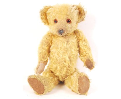 A vintage c1930's pre-war English teddy bear. Likely Chad Valley, but with no makers label present. Blonde mohair, with orang