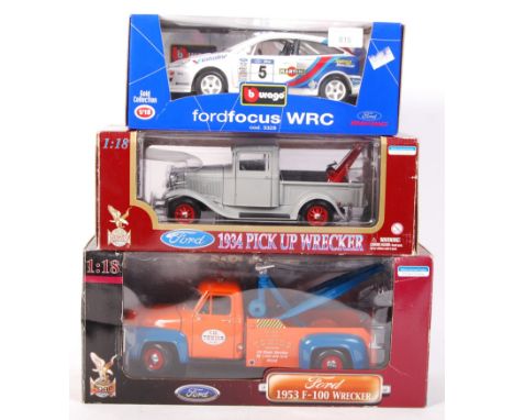 A collection of 3x 1:18 scale precision boxed diecast model cars. All appear mint, within their original boxes. Comprising: B