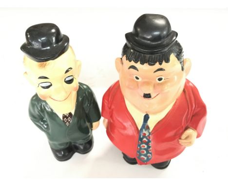 2 Ceramic Money Boxes in The form of Laurel and Hardy. Maker unknown. Approximate height 20CM. NO RESERVE