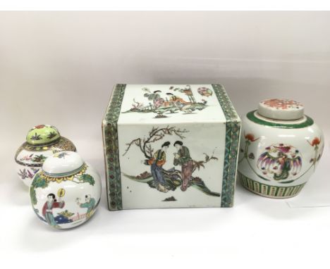 An Oriental ceramic pillow and three ginger jars and covers (4).