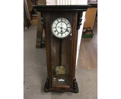 A mahogany cased wall clock with white enamel dial and Roman numerals. NO RESERVE